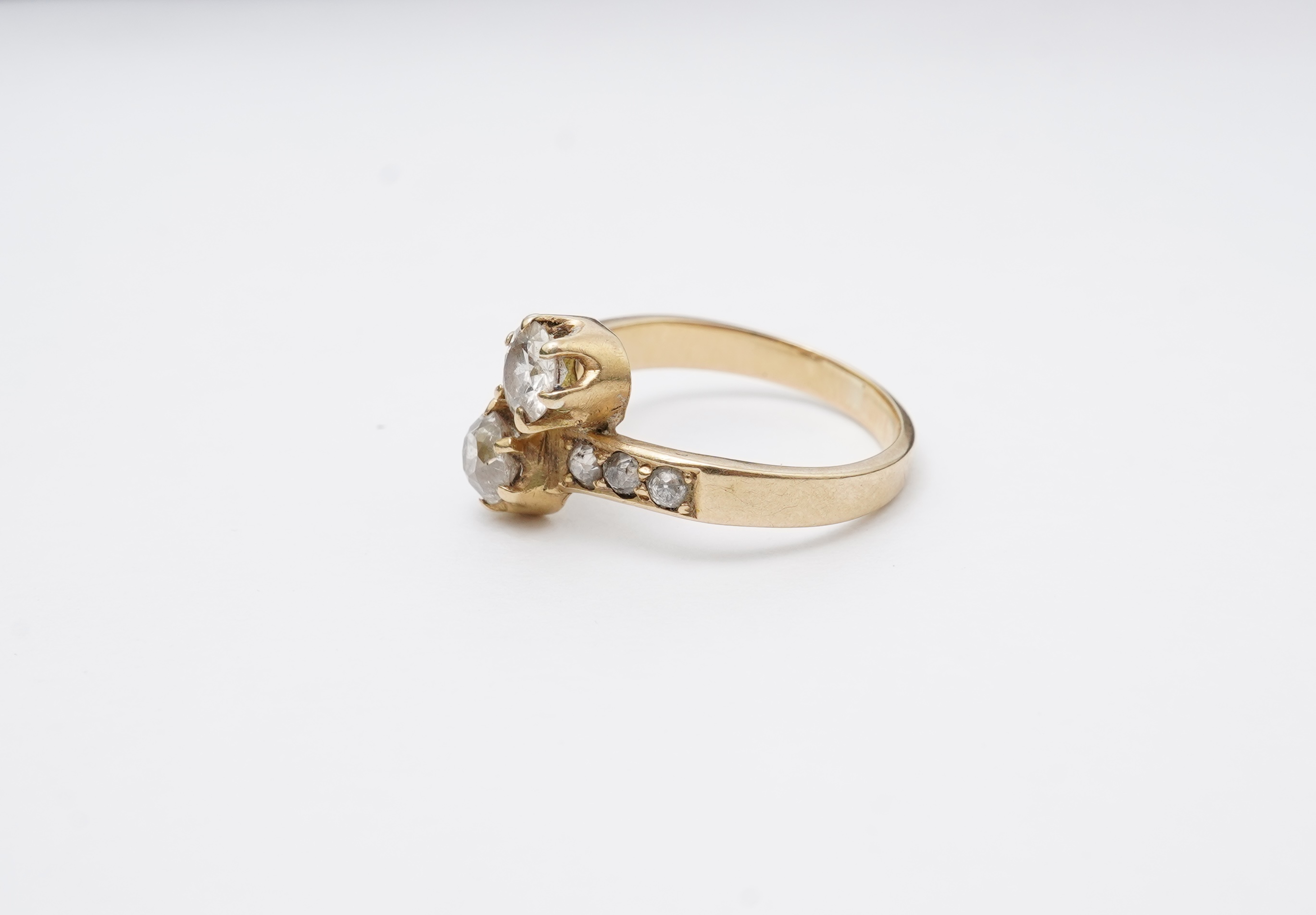 A gold and diamond 'toi-et-moi' ring, circa 1900